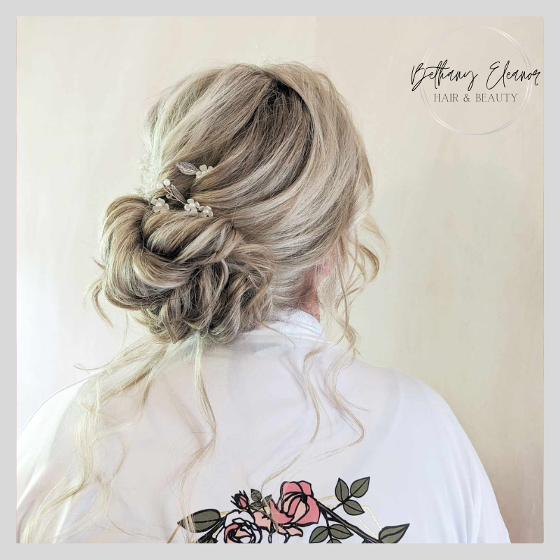 Image of bridal hair, braided plait across one side of the head by Bethany Eleanor Hair & Beauty